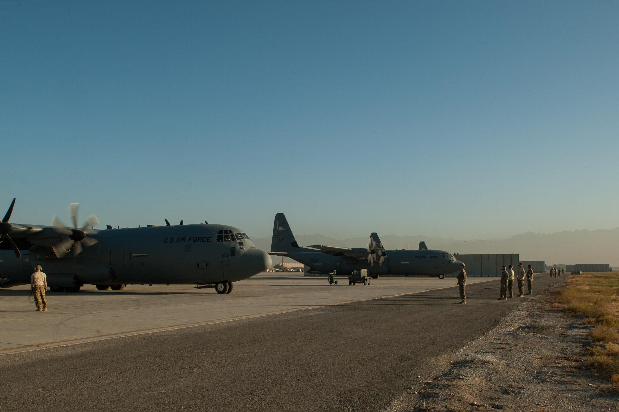 U.S. Air Force C-130J Super Hercules aircraft assigned to the 774th Expeditionary Airlift Squadron are prepped before taking off from Bagram Airfield, Afghanistan, Sept. 12, 2015. The aircraft and the rest of the squadron were in the process of redeploying back to Little Rock Air Force Base after successfully completing their deployment. During their rotation as the 774th Expeditionary Airlift Squadron, the Little Rock team completed 1,850 combat sorties and moved 14,500 passengers and 17 million pounds of cargo.  (U.S. Air Force photo by Tech. Sgt. Joseph Swafford/Released)