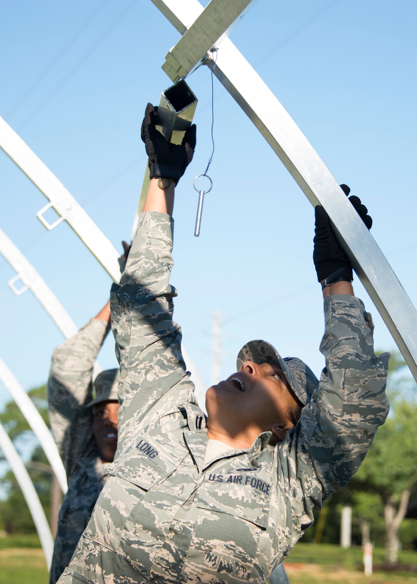 Capt. Sonya Long, 919th Special Operations Force Support Squadron, lifts a beam during small shelter system training at Duke Field, Fla., Sept. 13. The shelter takes six fully trained personnel approximately three and a half hours to complete. The SSS training is part of annual home station readiness training for all members of the squadron. (U.S. Air Force photo/ Tech. Sgt. Jasmin Taylor)  