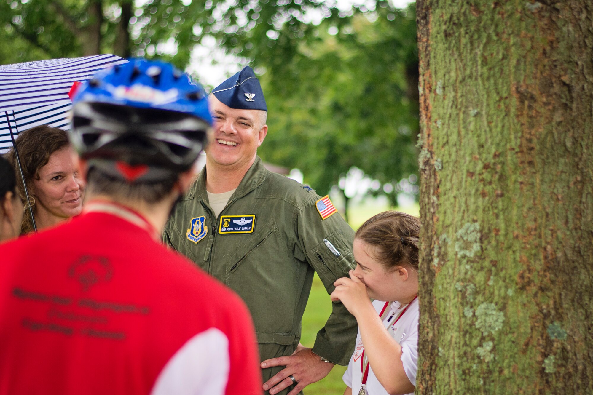 Col. D. Scott Durham, 512th Airlift Wing commander, speaks with Special Olympic participant Michael Eachus after the 10K cycling competition Sept. 12th, on Dover Air Force Base, Delaware. The sixth-annual Special Olympics Cycling Classic on Dover AFB welcomed participants, fans, and volunteers from throughout the region to compete in cycling events. (U.S. Air Force photo/Capt. Bernie Kale)