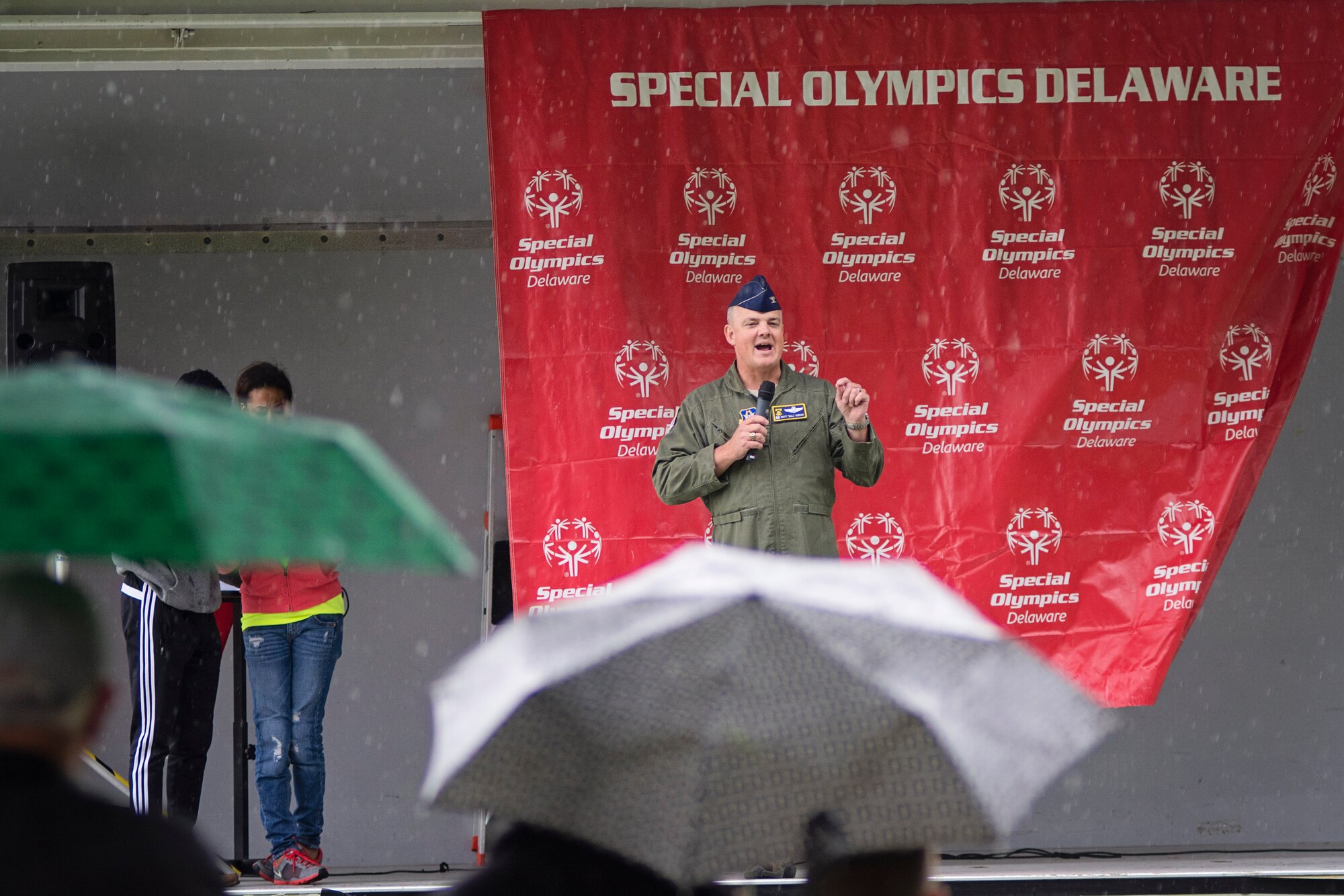 Col. D. Scott Durham, 512th Airlift Wing commander, speaks to Special Olympic participants and volunteers during the closing ceremony, Sept. 12th, on Dover Air Force Base, Delaware. The sixth-annual Special Olympics Cycling Classic on Dover AFB welcomed participants, fans, and volunteers from throughout the region to compete in cycling events. (U.S. Air Force photo/Capt. Bernie Kale)