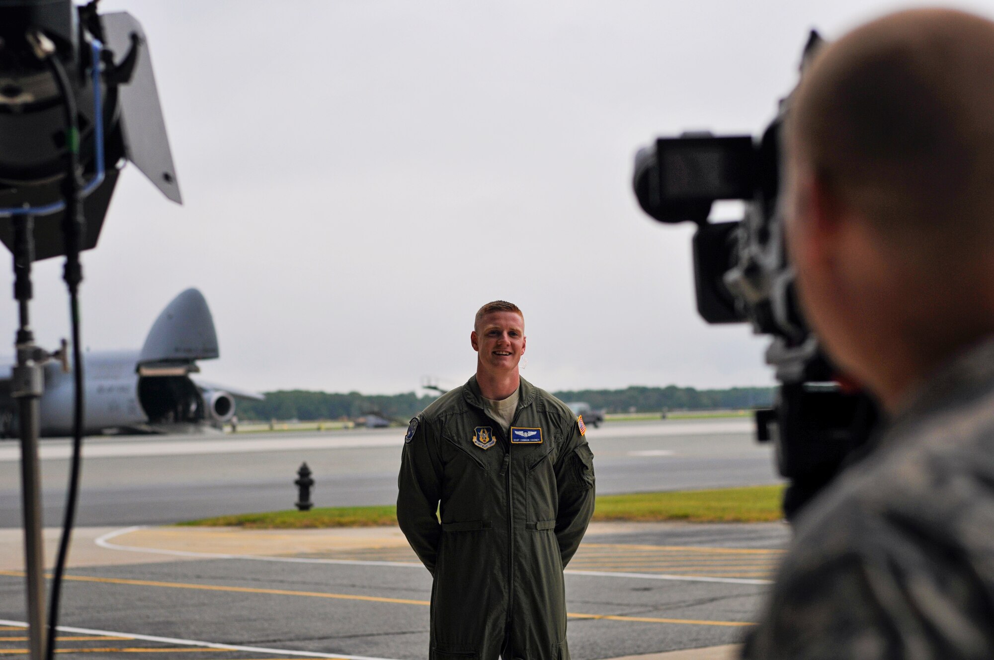 Staff Sgt. Connor Cooney, a 512th Airlift Wing loadmaster, talks with a Defense Media Activity broadcaster while waiting for his turn on the webcast Troop Talk. Cooney almost had the opportunity to ask the President of the United States a question Sept. 11 via satellite, during a live-streaming webcast on Dover Air Force Base, Delaware, but was cut after the show went over the time limit. (U.S. Air Force photo by Capt. Bernie Kale)