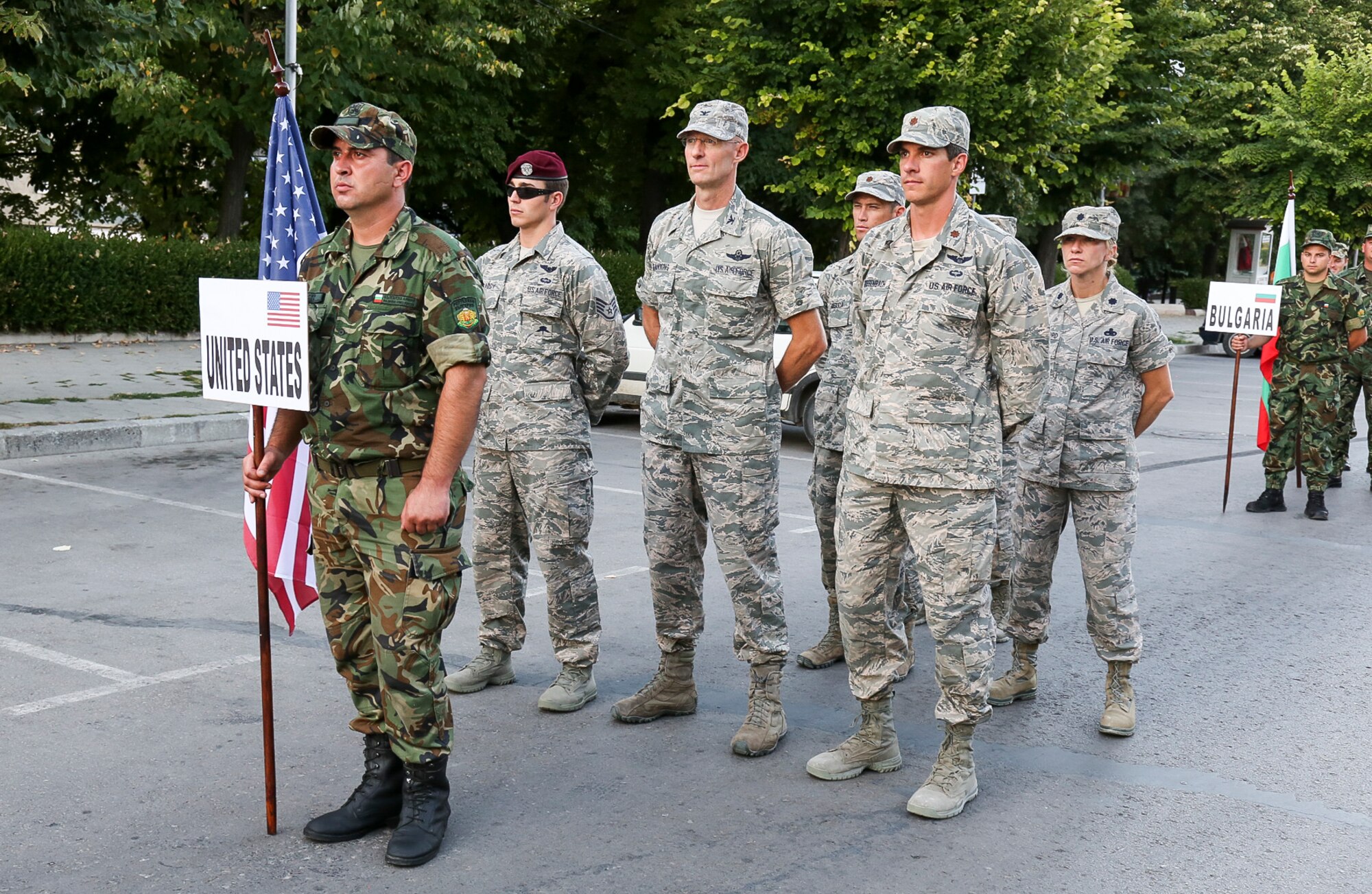 Team USA Military stands fast during the opening ceremonies the Interallied Confederation of Reserve Officers, or CIOR, military competition in Shumen, Bulgaria. Two Reserve C-17 pilots – Maj. Peter Grossenbach, from the 728th Airlift Squadron, and Maj. Mike Masuda, from the 313th Airlift Squadron – represented Team USA Military during the annual international military pentathlon competition Aug. 2. Grossenbach represented the U.S. as part of an international team and won third place in the novice category. Masuda rejoined his team for another bout, this time competing in the experienced category. The pentathlon consists of: pistol shooting, rifle shooting, 500-meter land obstacle course, 50-meter water obstacle course, and up to a 15-kilometer orienteering, or land-navigation, event that also encompasses combat first aid. According to the CIOR Web site, the competition focuses on military skills that truly challenge the leadership and physical robustness of reservists. (Courtesy photo)