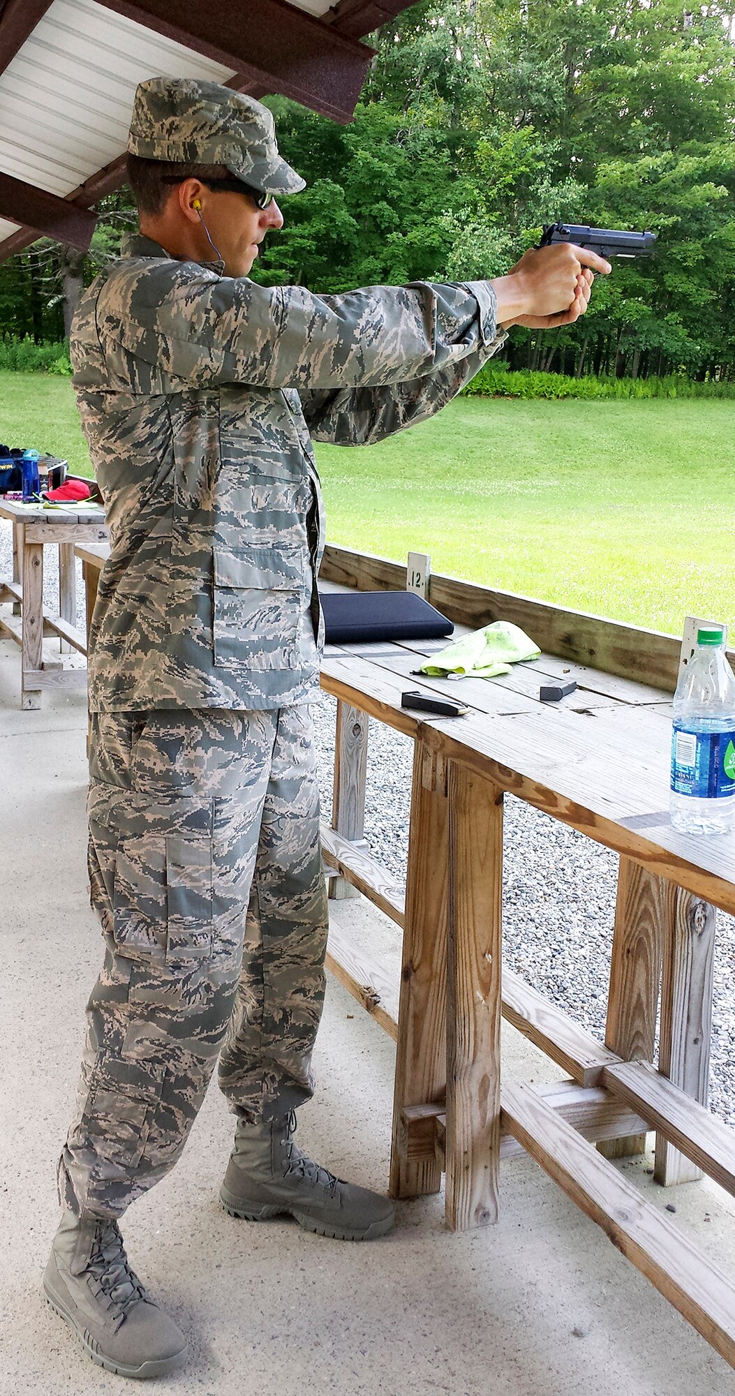Maj. Peter Grossenbach, C-17 Globemaster III pilot with the 728th Airlift Squadron, performs pistol training during the Team USA Military training camp in Burlington, Vermont, in July. After trying out and qualifying for the team, Grossenbach went on to compete in the Interallied Confederation of Reserve Officers, or CIOR, military competition in Shumen, Bulgaria, Aug. 3-9. He represented the U.S. as part of an international team and won third place in the novice category. The pentathlon consists of: pistol shooting, rifle shooting, 500-meter land obstacle course, 50-meter water obstacle course, and up to a 15-kilometer orienteering, or land-navigation, event that also encompasses combat first aid. According to the CIOR Web site, the competition focuses on military skills that truly challenge the leadership and physical robustness of reservists. (U.S. Air Force Reserve photo by Maj. Mike Masuda)