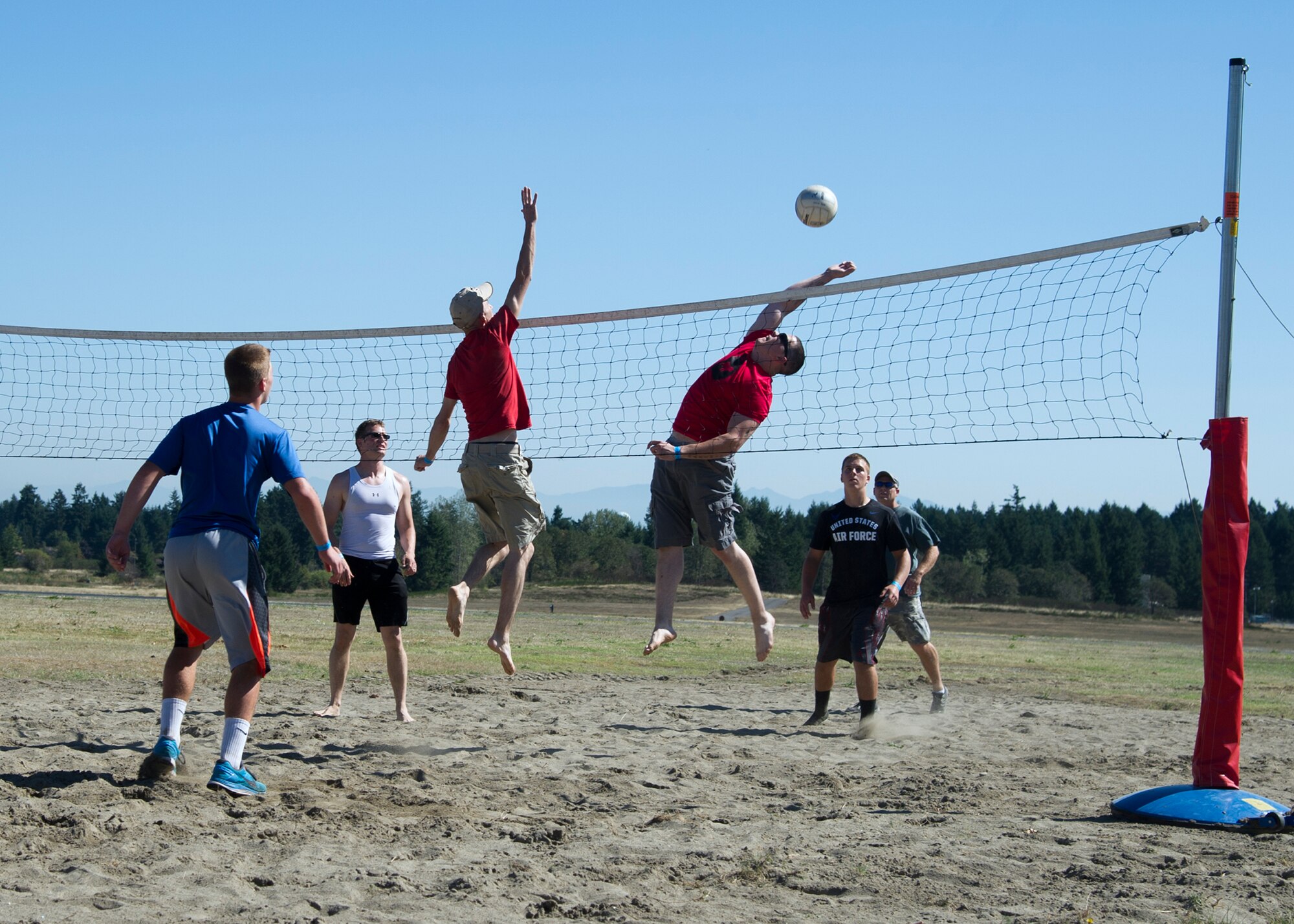 Airman and their families from the 446th Airlift Wing play a game of volleyball September 12, 2015, during the annual family day picnic at McChord Field. This year’s festivities included a spouse flight, barbeque and numerous games and activities for Reservists and families. (U.S. Air Force Reserve photo by Tech. Sgt. Bryan Hull/released) 