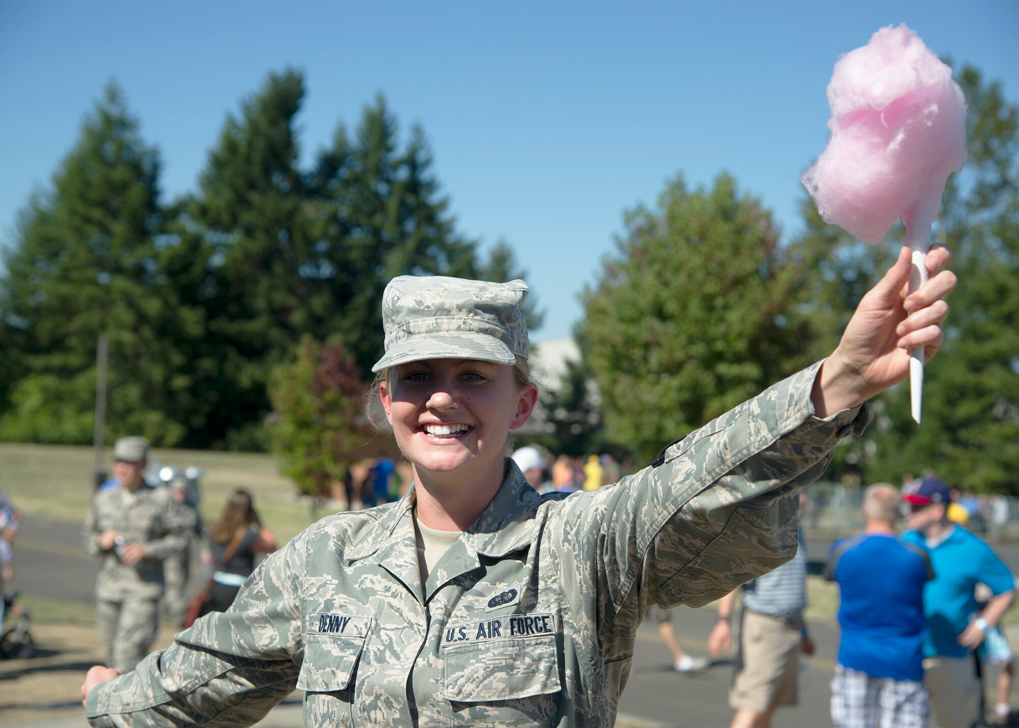 Staff Sgt. Jade Denny, assigned to the 446th Force Support Squadron, holds up her cotton candy September 12, 2015, during the annual family day picnic at McChord Field.  This year’s festivities included a spouse flight, barbeque and numerous games and activities for Reservists and families. (U.S. Air Force Reserve photo by Tech. Sgt. Bryan Hull/released) 