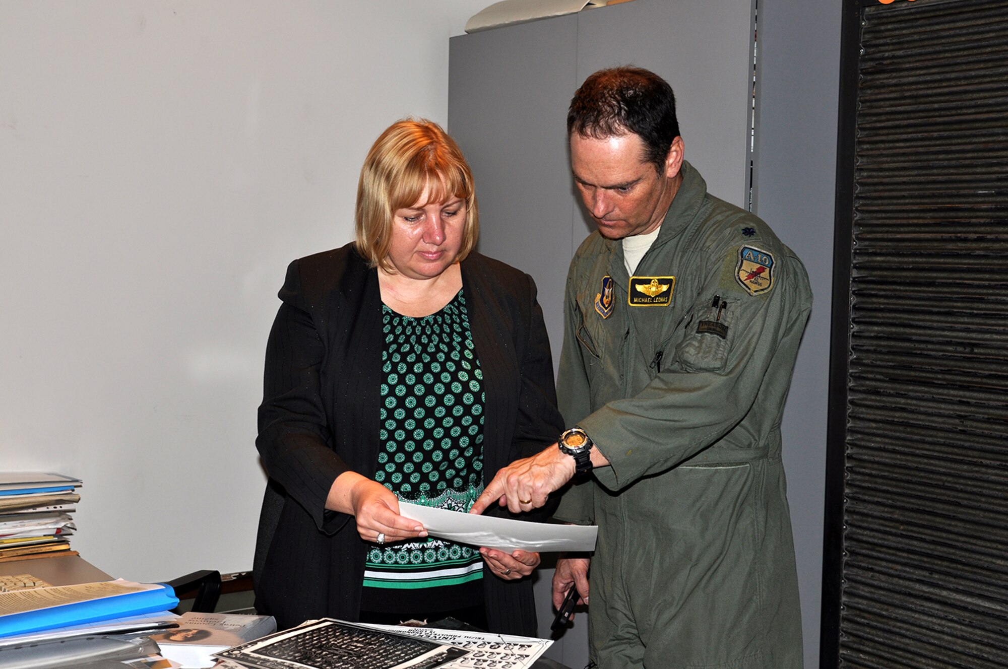 A-10 Thunderbolt II pilot, Lt. Col. Michael Leonas, 303d Fighter Squadron, looks through archive photos of his great grandfather Petras Leonas at Vytautas Magnus University in Kaunas, Lithuania Sept. 9. Leonas made history when he landed the first ever A-10 at Kaunas International Airport.  He also has family ties to Lithuania as his great grandfather was a powerful and respected man in from the 1920s until his death in 1938. He held many positions to include Minister of Justice, lawyer and professor. (U.S. Air Force photo by Capt. Denise Haeussler)