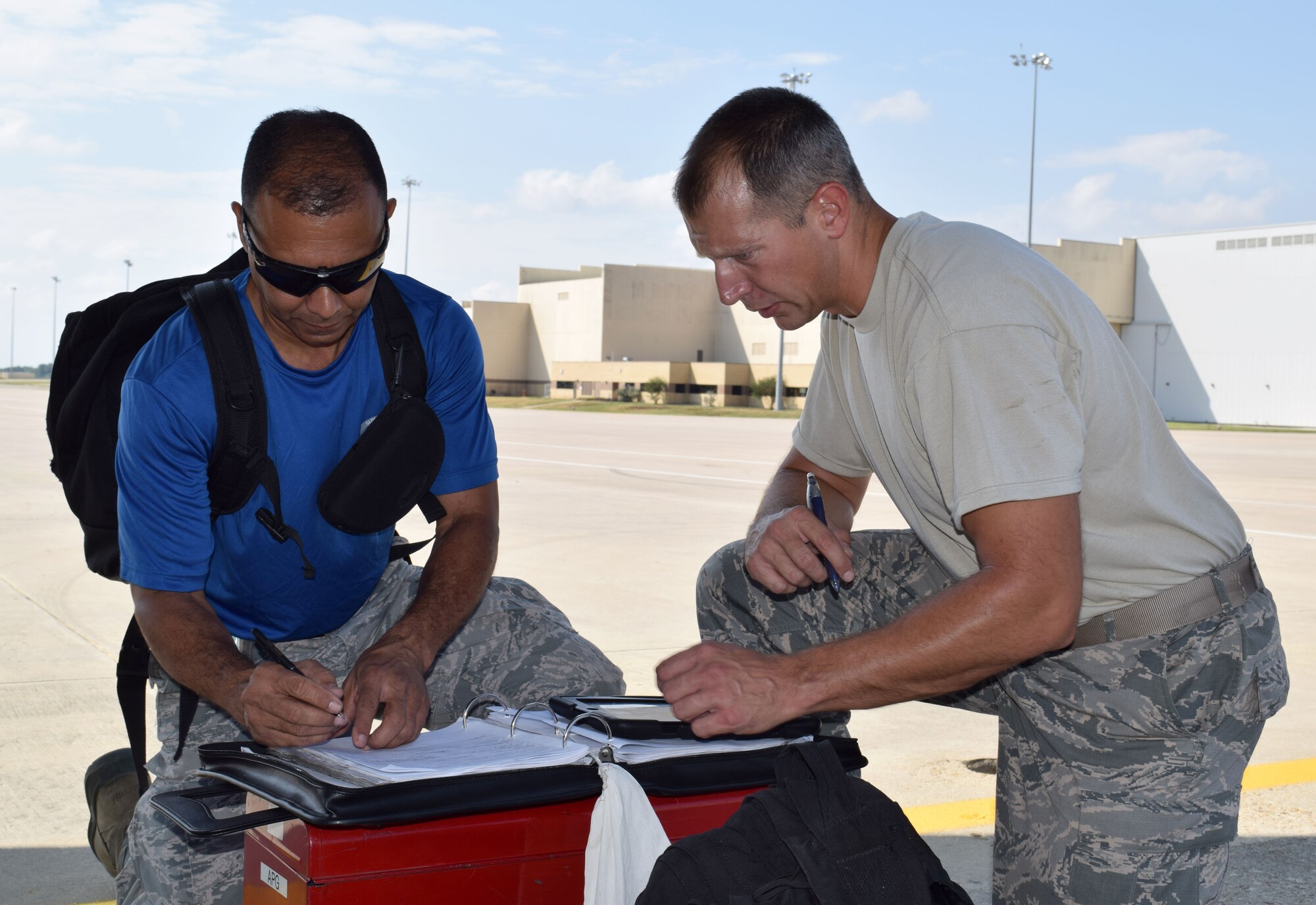 Staff Sgt. Richard Slifer (right), 433rd Aircraft Maintenance Squadron electrical environmental craftsman, runs through a checklist with Staff Sgt. Eldry Nunez, 433rd AMXS aircraft electrician Sept. 13, 2015 on the Joint Base San Antonio-Lackland flightline. Slifer was recently selected for promotion under the Air Force Reserve Command Stripes for Exceptional Performers II program. He officially wears his new rank of technical sergeant on Oct. 1, 2015. (U.S. Air Force photo/Tech. Sgt. Lindsey Maurice)