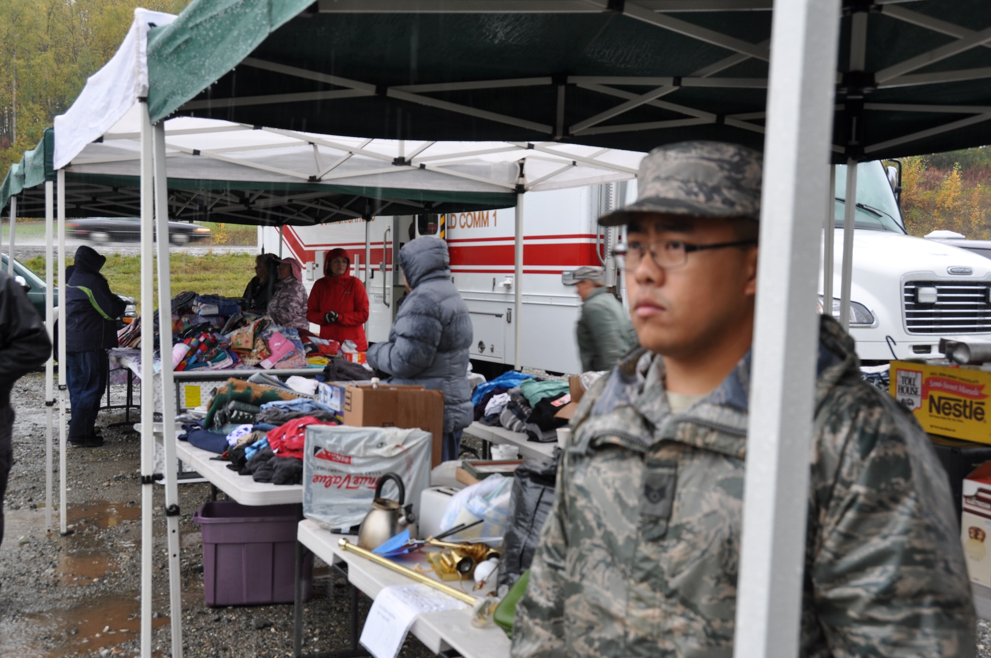 Staff Sgt. Soo Xiong, an Air Force Reservist assigned to the 477th Fighter Group, assists members of the Willow Recovery Team disseminate donated items to the families affected by the Sockeye fire. The Sockeye fire began in June and destroyed thousands of acres of land to include including 55 homes, near Willow, Alaska. (U.S. Air Force photos/Maj. Ashley Conner)
