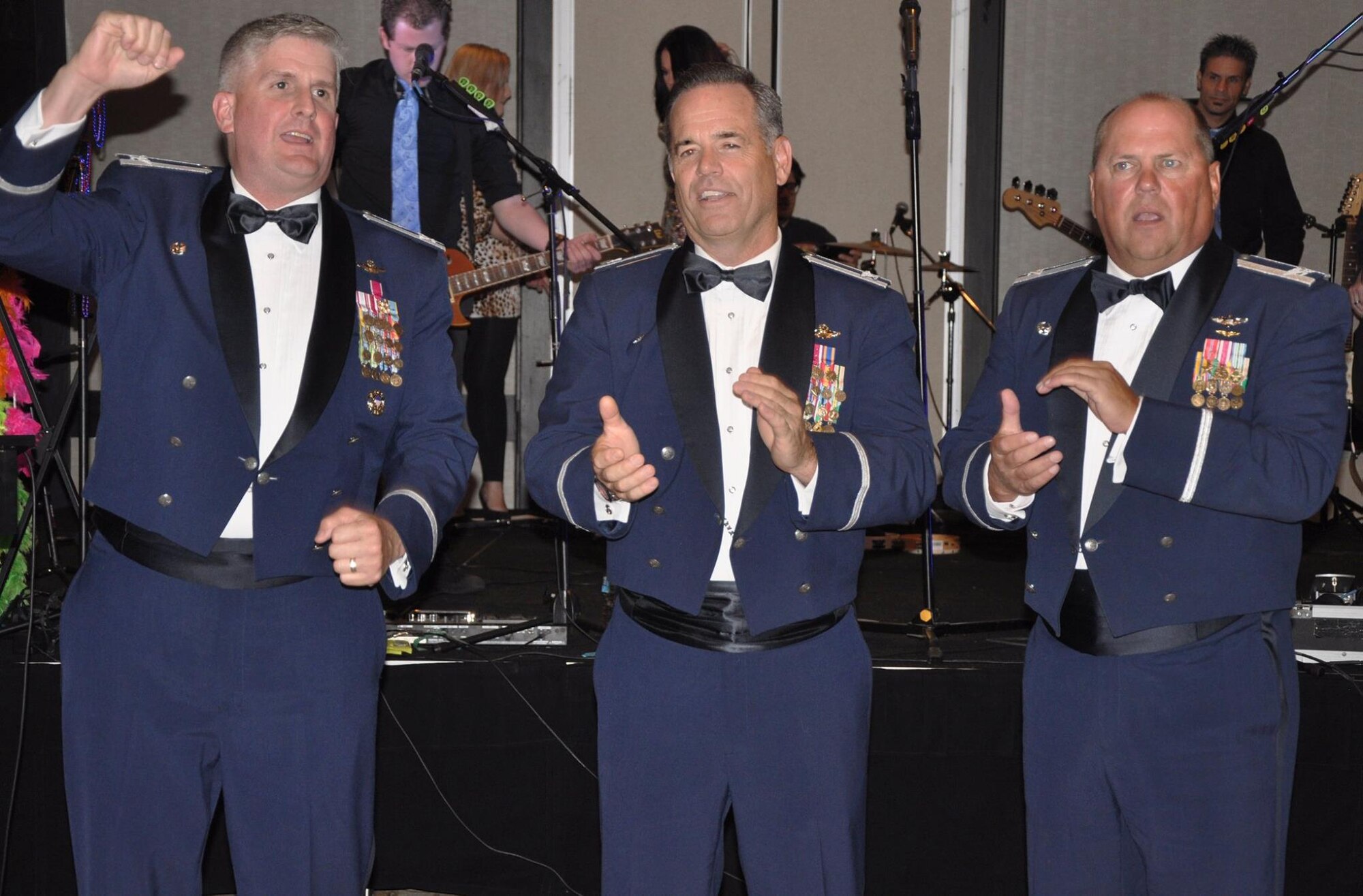 (Left to right) Col. Albert Miller, 22nd Air Refueling Wing commander, Col. Mark S. Larson, 931st Air Refueling Group commander, and Col. Jeff J.J. Jordan, 184th Intelligence Wing commander, sing the Air Force Song at the Air Force Ball in Wichita, Kan., Sept. 12, 2015. The event was a celebration of the 68th birthday of the Air Force. Mike Pompeo was the guest of honor, and spoke about what it means to him to be a representative in Congress for the area. (U.S. Air Force photo by Tech. Sgt. Abigail Klein)