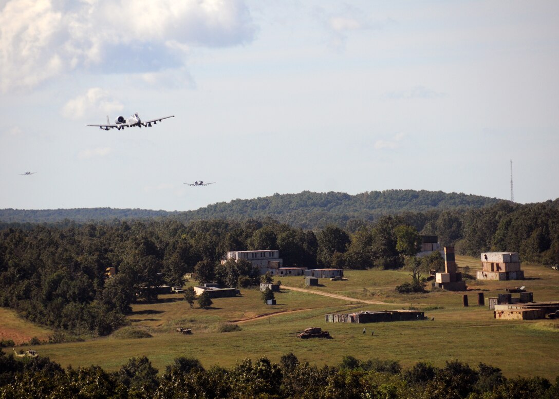 Central Missouri community members watch as A-10 fighter aircraft of the 442nd Fighter Wing fly over an outreach event hosted by the Missouri Air National Guard’s 131st Bomb Wing, Detachment 1 - Cannon Range, near Laquey, Missouri, Sept. 12, 2015.  More than 850 guests participated in the family-friendly event that included munitions demonstrations by the B-2 Spirit stealth bomber, A-10 Thunderbolt II attack aircraft, and  C-130 Hercules transport. (U.S. Air National Guard photo by Senior Airman Nathan Dampf)