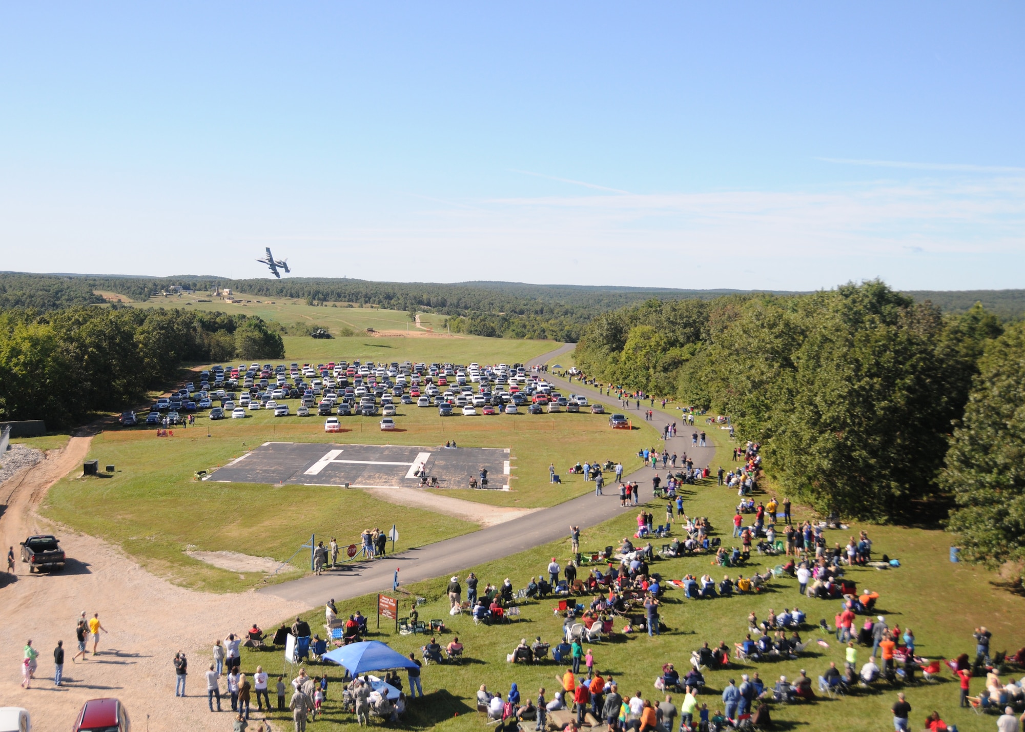 Central Missouri community members watch as A-10 fighter aircraft of the 442nd Fighter Wing fly over an outreach event hosted by the Missouri Air National Guard’s 131st Bomb Wing, Detachment 1 - Cannon Range, near Laquey, Missouri, Sept. 12, 2015.  More than 850 guests participated in the family-friendly event that included munitions demonstrations by the B-2 Spirit stealth bomber, A-10 Thunderbolt II attack aircraft, and  C-130 Hercules transport. (U.S. Air National Guard photo by Senior Airman Nathan Dampf)