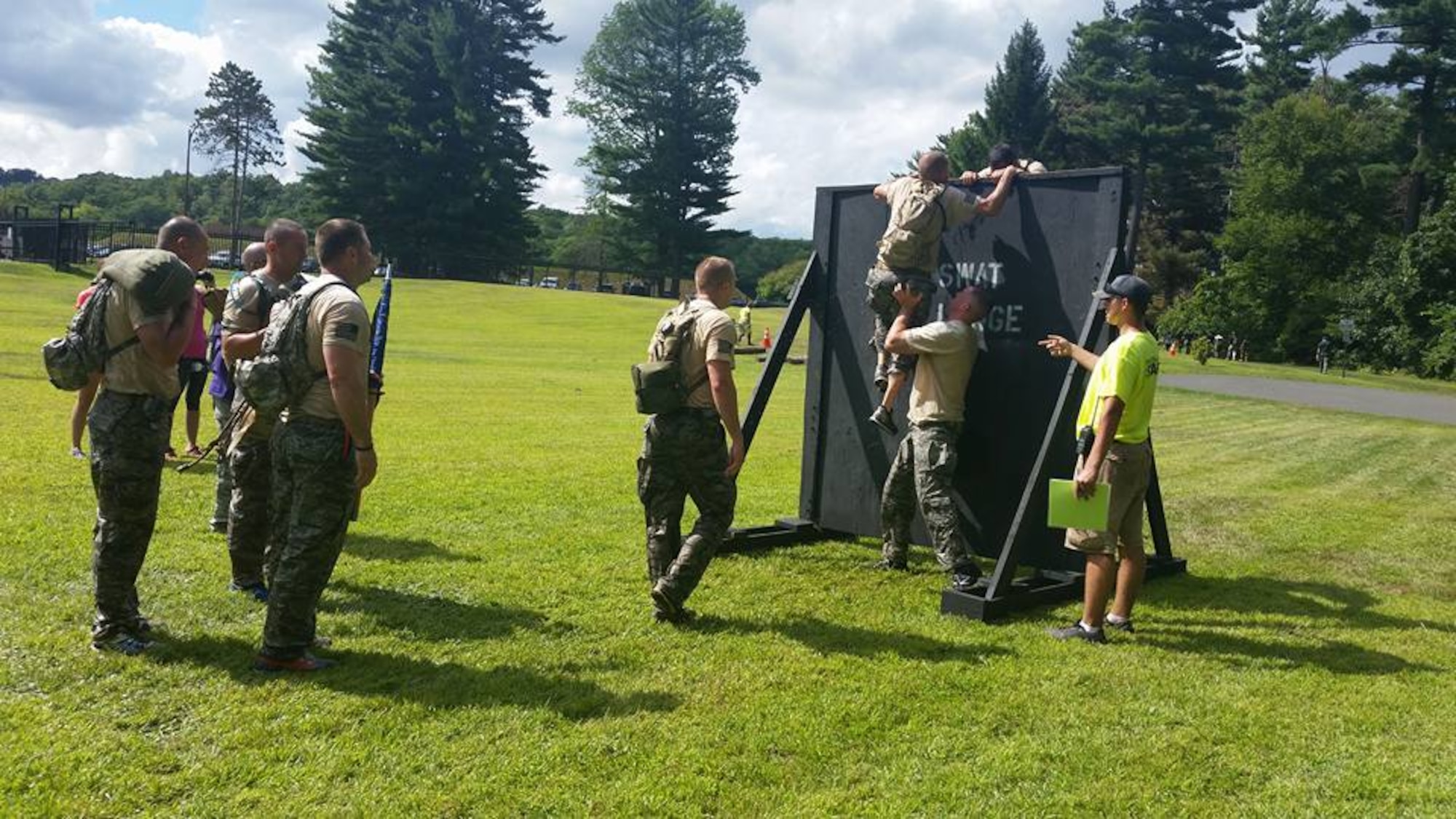 The 2015 103rd Security Forces Squadron SWAT Challenge team attack the first obstacle at the MDC Reservoir in West Hartford, Conn., during the annual Connecticut SWAT Challenge in September. (U.S. Air National Guard photos by Tech. Sgt. Jessica Roy)