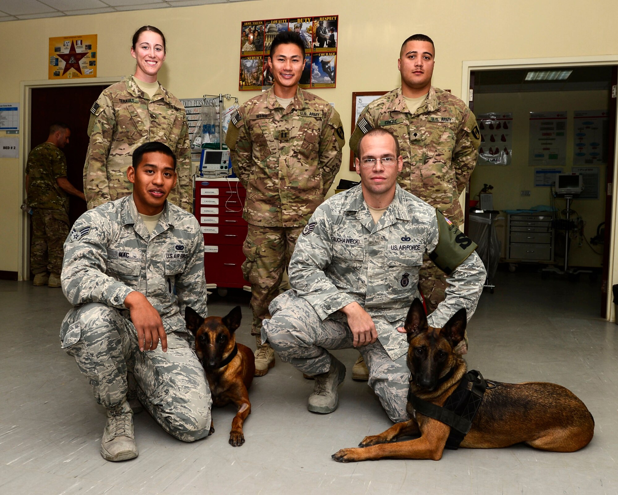 Members from the 463rd Military Detachment Veterinary Service and the 386 Expeditionary Security Forces Squadron visit hospitals in the area of responsibility to conduct MWD medical emergency training at an undisclosed location in Southwest Asia, Sept. 12, 2015. The team traveled to conduct training to medical personnel throughout the area of responsibility, providing information on support and stabilizing MWDs until more advanced care is available. (U.S. Air Force photo by Senior Airman Racheal E. Watson/Released)