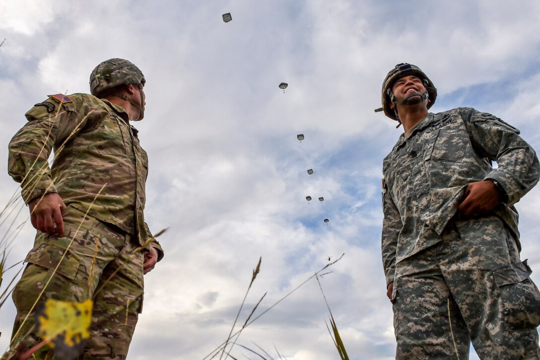 Paratroopers observe an airborne operation over the Malemute drop zone on Joint Base Elmendorf-Richardson, Alaska, Sept. 10, 2015. The paratroopers are assigned to U.S. Army Alaska. Army Maj. Gen. Bryan Owens, commander of United States Army Alaska participated in the training operation. U.S. Air Force photo by Justin Connaher