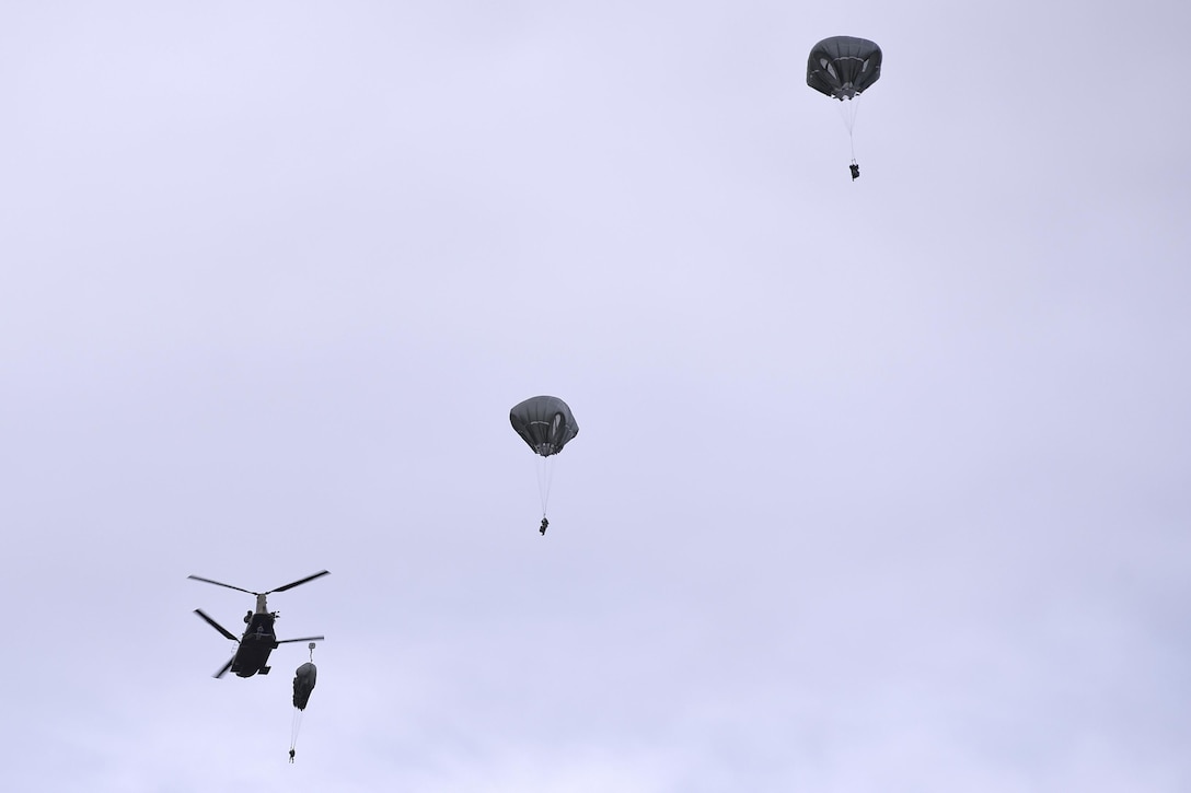 Paratroopers conduct airborne operations from CH-47 Chinook helicopters over Malemute drop zone on Joint Base Elmendorf-Richardson, Alaska, Sept. 10, 2015. U.S. Air Force photo by Justin Connaher