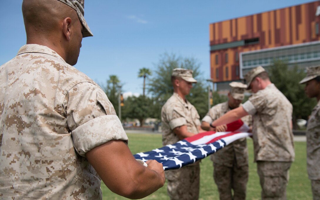 Marines retire the American flag for the final time in the city of Phoenix at Civic Space Park Sept. 13, 2015. More than 800 Marines participated in Marine Week Phoenix to give the citizens of the greater Phoenix area the opportunity to meet the individual Marines and celebrate community, country and Corps.