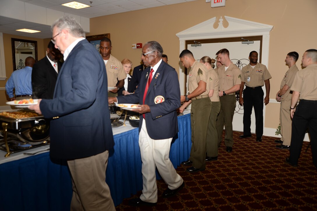 Base officials, Marines and visitors prepare to dine during Marine Corps Logistics Base Albany’s annual POW-MIA Prayer Breakfast. The ceremony, which was held on base recently, commemorated our nation's captured and/or missing service members.
