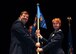 Col. Gregory Gilmour, 315th Airlift Wing commander, passes the 315th Mission Support Group guidon to Col. Cherie Roff, new 315th MSG commander, during an assumption of command ceremony at Joint Base Charleston, S.C. Sept. 13, 2015. (U.S. Air Force Photo by Senior Airman Tom Brading)