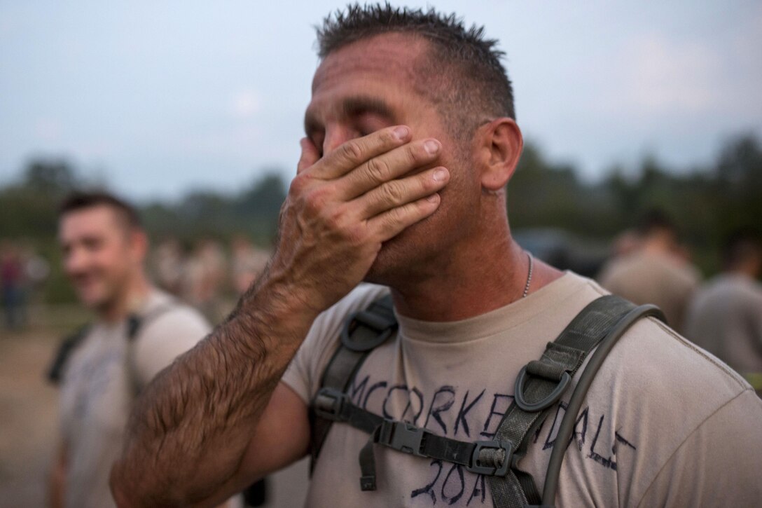 Army Staff Sgt. Travis McCorkendale wipes sweat off his face after a 2-mile run during the Sapper Stakes 2015 Army Physical Fitness Test on Fort Chaffee, Ark., Aug. 31, 2015. McCorkendale is an engineer assigned to the Army Reserve's 348th Engineer Company. U.S. Army photo by Master Sgt. Michel Sauret