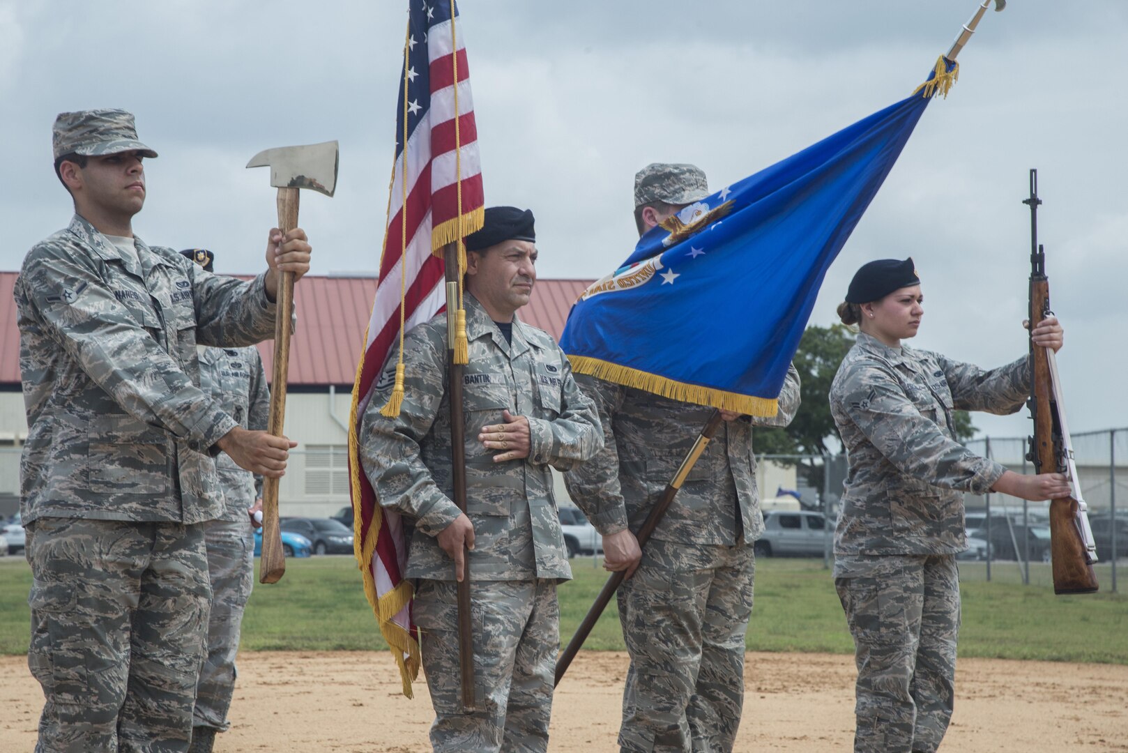 Airman Evan Nares, 502nd Civil Engineer Squadron firefighter, Staff Sgt. Fredric Bantin, 902nd Security Forces Squadron entry controller, Senior Airman Corey Lindner, 502nd CES firefighter, and Airman 1st Class Rose Dror, 902nd SFS entry controller, present the colors during an honor guard ceremony for beginning of the 2015 Joint Base San Antonio Battle of the Badges Sept. 11, 2015, at JBSA-Randolph. Battle of the Badges takes place each year to build camaraderie, espirit de corps and cohesion among JBSA first responders through various competitive challenges based on their daily mission readiness requirements.