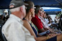 U.S. Marines, Sailors, and family members attend a change of command ceremony at Marine Corps Base Camp Pendleton, Calif., Sept. 10, 2015. The ceremony signifies the transfer of responsibility and authority of 1st Marine Division between Commanding Generals. (U.S. Marine Corps photo by Pfc. Nathaniel Castillo, 1st Marine Division Combat Camera/Released)