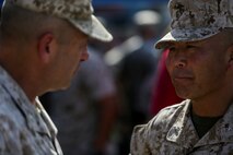 U.S. Marine Corps Brig. Gen. Daniel D. Yoo, 1st Marine Division Commanding General, relinquishes command to Maj. Gen. Daniel J. O'Donohue  during a change of command ceremony at Marine Corps Base Camp Pendleton, Calif., Sept. , 2015. Yoo assumed command as the 80th Commanding General of 1st Marine Division on Sept. 10, 2015. (U.S. Marine Corps photo by Pfc. Nathaniel Castillo, 1st Marine Division Combat Camera/Released)