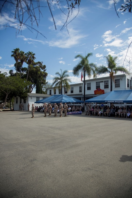 U.S. Marines, Sailors, and family members attend a change of command ceremony at Marine Corps Base Camp Pendleton, Calif., Sept. 10, 2015. The ceremony signifies the transfer of responsibility and authority of 1st Marine Division between Commanding Generals. (U.S. Marine Corps photo by Sgt. Luis A. Vega, 1st Marine Division Combat Camera/Released)