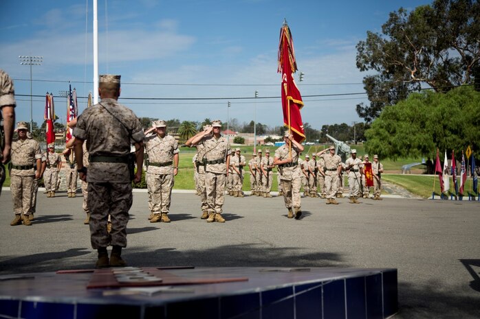 U.S. Marine Corps Sgt. Maj. William T. Sowers, 1st Marine Division Sergeant Major, presents the battle colors to Brig. Gen. Daniel D. Yoo, 1st Marine Division Commanding General, during a change of command ceremony at Marine Corps Base Camp Pendleton, Calif., Sept. 10, 2015. The ceremony signifies the transfer of responsibility and authority of 1st Marine Division between Commanding Generals. (U.S. Marine Corps photo by Sgt. Luis A. Vega, 1st Marine Division Combat Camera/Released)