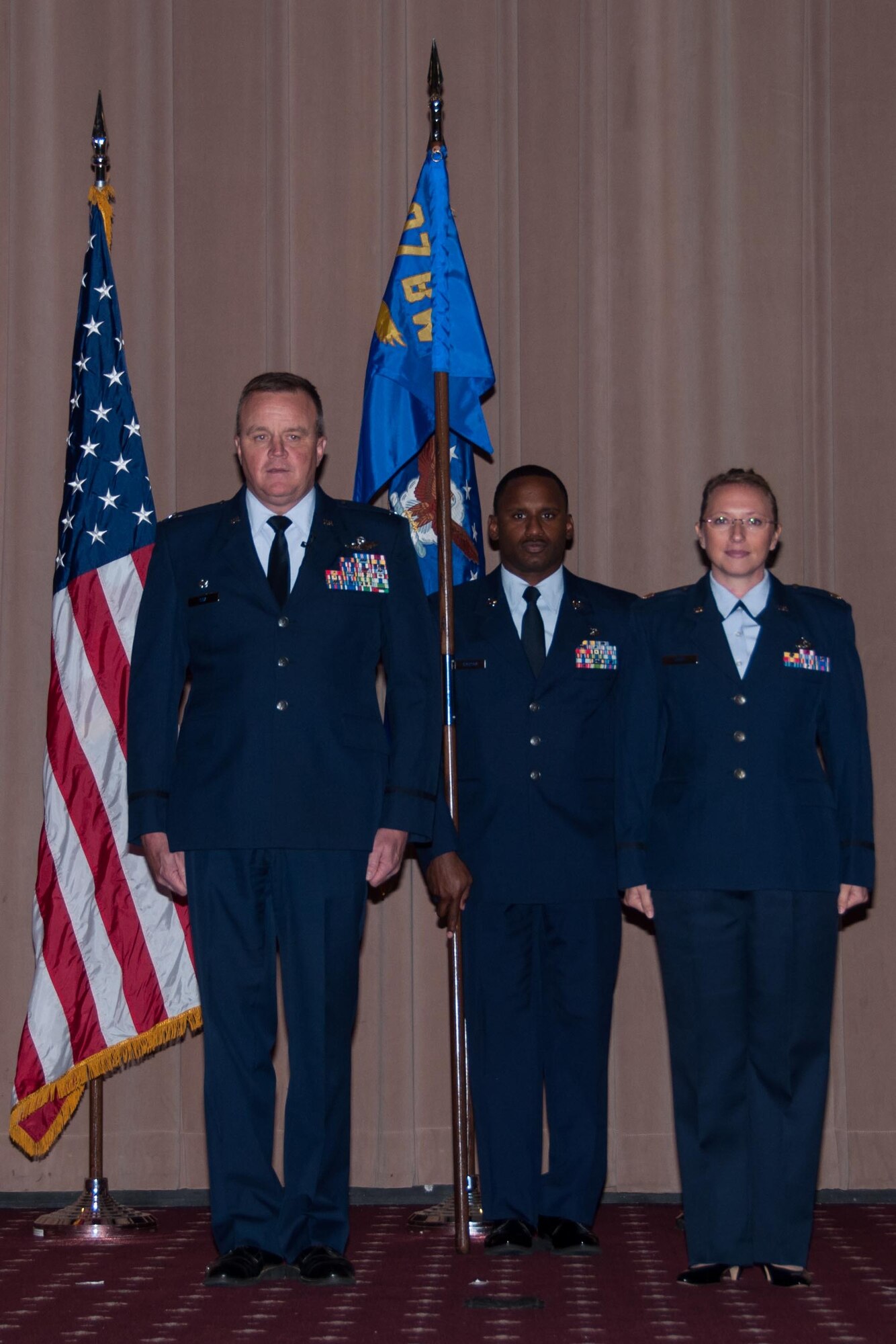U.S. Air Force Col. Bruce R. Cox, commander of the 307th Bomb Wing, prepares to hand the reigns of command for the 307th Force Support Squadron to Maj. Beth Hart in an assumption of command ceremony on September 12, 2015 at Barksdale Air Force Base, Louisiana. Master Sgt. Carlos Jackson acted as guidon bearer for the ceremony. Hart is the former 307 Bomb Wing Executive Officer.
(U.S. Air Force photo by Master Sgt. Laura Siebert/Released)