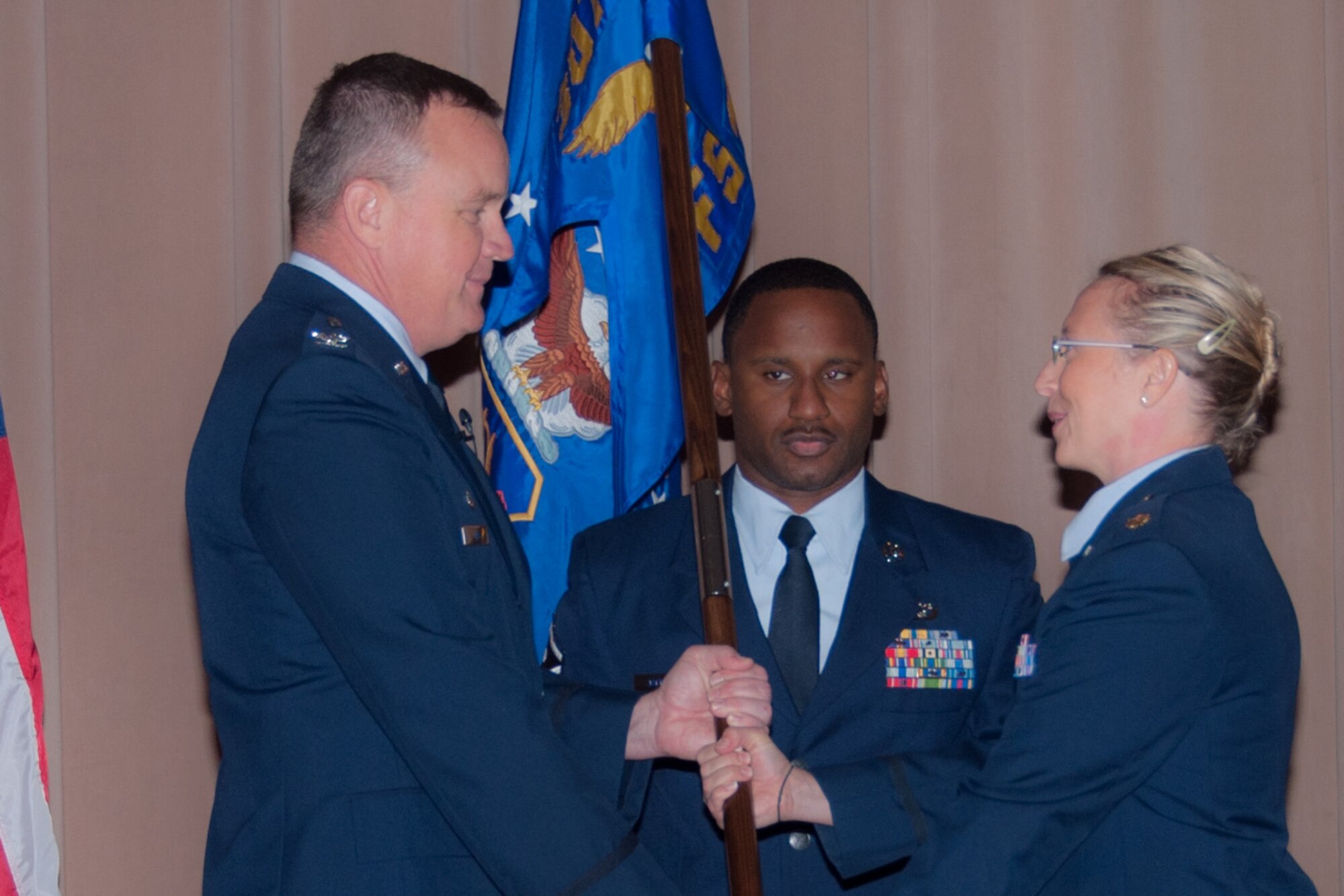 U.S. Air Force Col. Bruce R. Cox, commander of the 307th Bomb Wing, passes command of the 307th Force Support Squadron to Maj. Beth Hart on September 12, 2015 at Barksdale Air Force Base, Louisiana. Hart is the former 307 Bomb Wing Executive Officer. (U.S. Air Force photo by Master Sgt. Laura Siebert/Released)