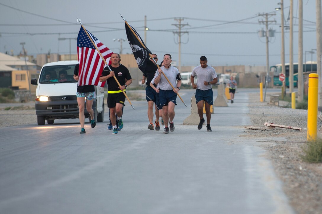 U.S. service members participate in a run to honor prisoners of war and those missing in action on Bagram Airfield, Afghanistan, Sept. 4, 2015. U.S. Air Force photo by Tech. Sgt. Joseph Swafford