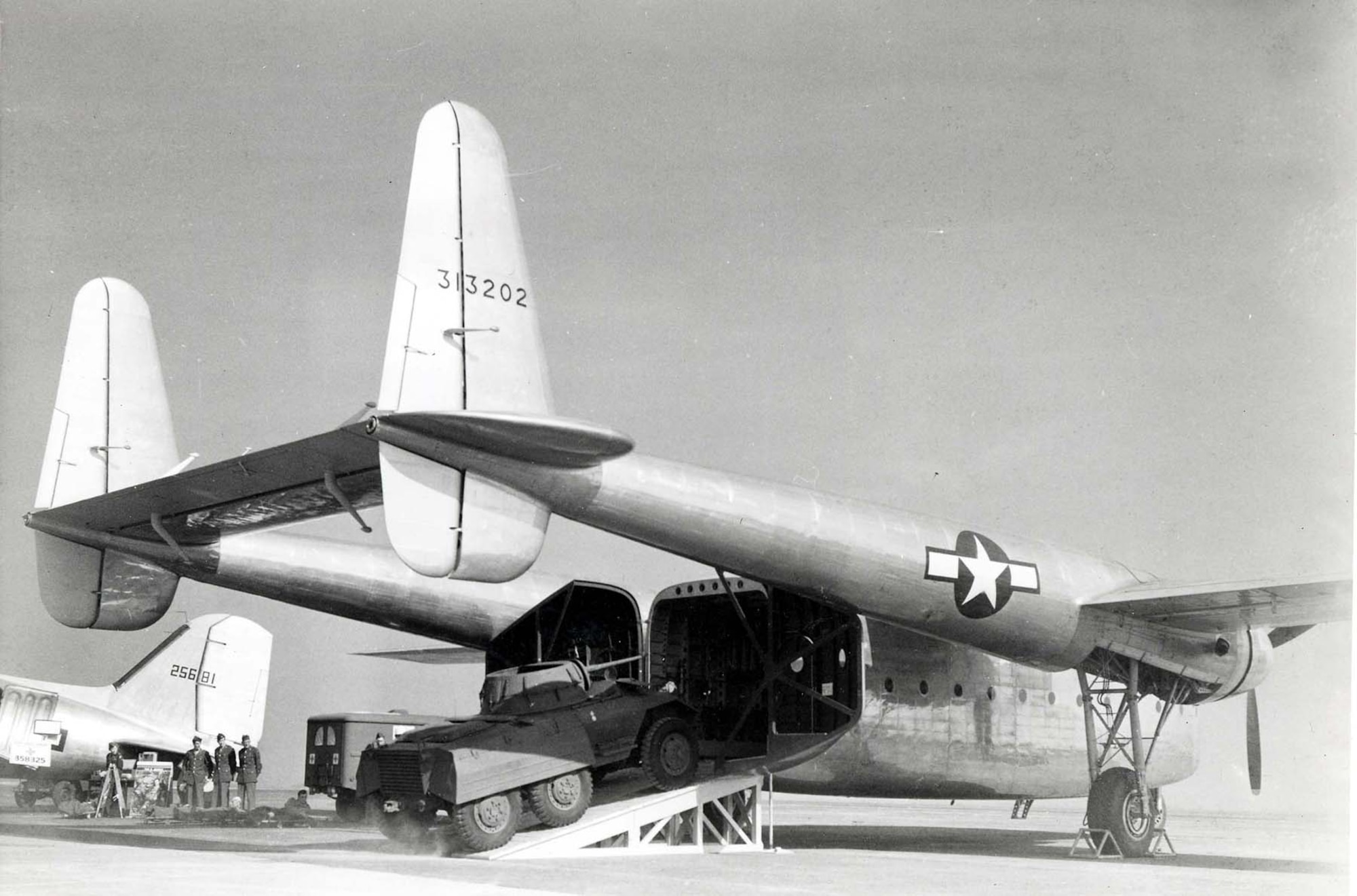 With its rear, clamshell doors opened wide, the C-82 displays its ability to load heavy cargo easily and quickly during a demonstration in October 1944. (U.S. Air Force photo)