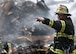 Retired Fire Chief Joseph Curry barks orders to rescue teams as they clear through debris that was once the World Trade Center. (U.S. Navy Photo/Journalist 1st Class Preston Keres)