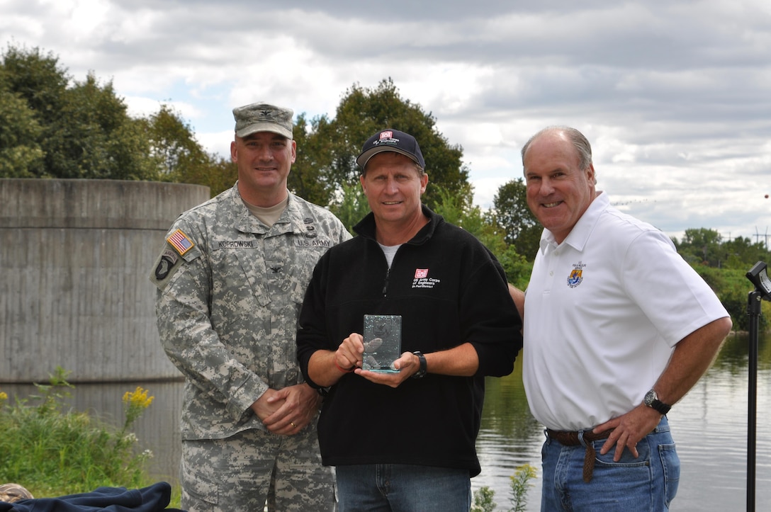 Col. Dan Koprowski, St. Paul District commander, left, and Charlie Wooley, U.S. Fish and Wildlife Service Midwest Regional deputy regional director, had the opportunity to congratulate Dan Kelner, mussels biologist, center, and the entire multi-agency mussel coordination team and staff at Necedah National Wildlife Refuge as winners of the Midwest Region’s 2014 Recovery Champion Awards for their work to save endangered freshwater mussels, whooping cranes, Karner blue butterflies and Kirtland’s warblers.

The interagency Mussel Coordination Team received the Midwest Region’s Partner Recovery Champion Award in recognition of their collaborative work to conserve and restore the endangered Higgins eye, a species of freshwater mussel, in the Upper Mississippi River.

The team, which began its work in 2000, includes members from U.S. Army Corps of Engineers, U.S. Fish and Wildlife Service, Minnesota Department of Natural Resources, Wisconsin Department of Natural Resources, Iowa Department of Natural Resources, Illinois Department of Natural Resources, National Park Service, U.S. Geological Survey, University of Minnesota, Illinois Natural History Survey and, two private companies.
