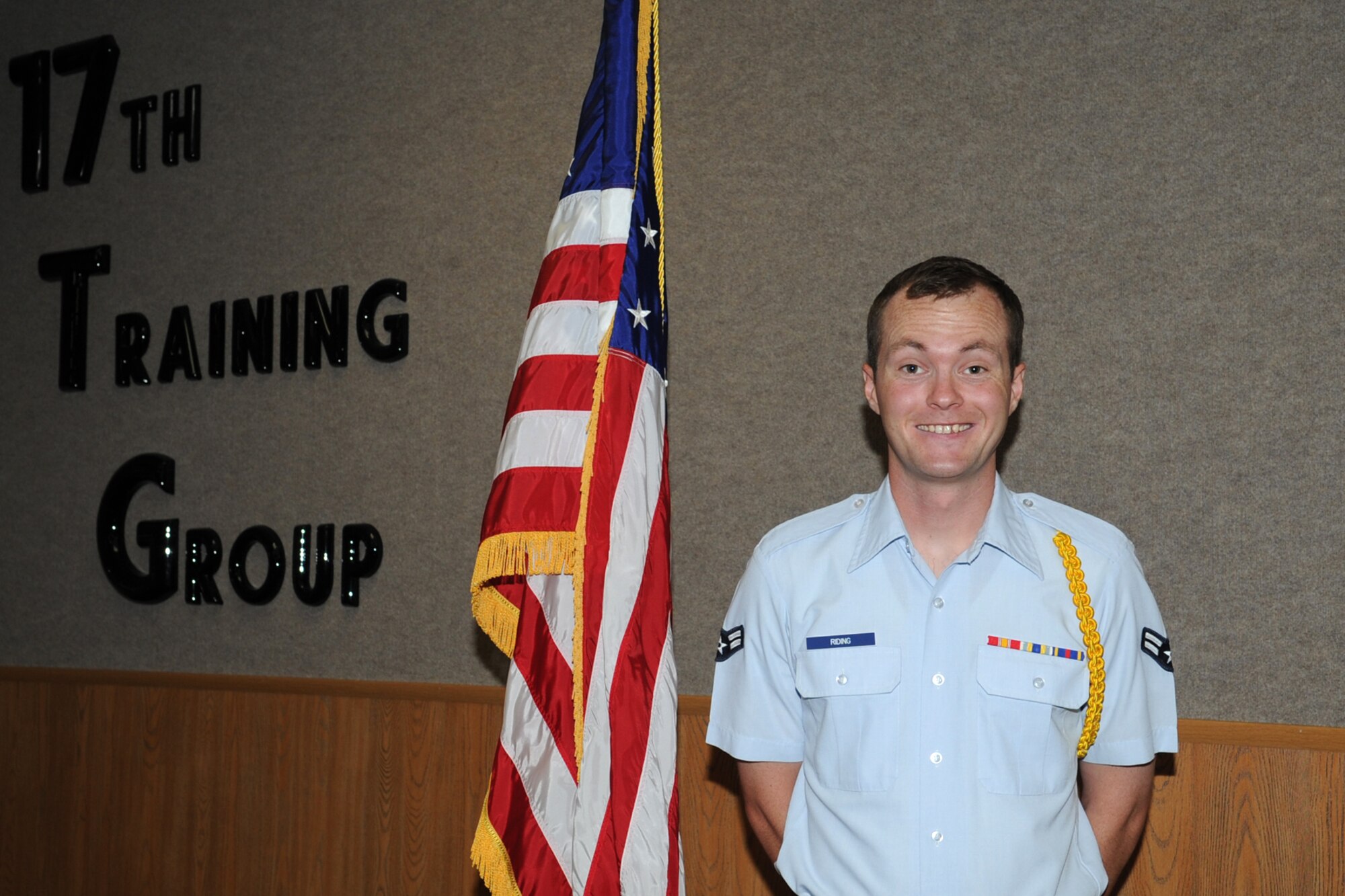 U.S. Air Force Airman 1st Class Justin B. Riding, 312th Training Squadron student, poses for a photo in Brandenberg Hall on Goodfellow Air Force Base, Texas, Sept. 11, 2015. Riding is the 17th Training Group August Student of the Month Spotlight, a series highlighting Team Goodfellow students. (U.S. Air Force photo by Staff Sgt. Laura R. McFarlane/Released)