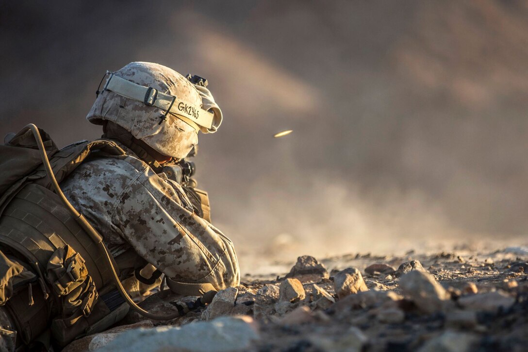 A Marine provides suppression fire during a simulated platoon attack mission as part of a training exercise on Marine Corps Air Ground Combat Center Twentynine Palms, Calif., Sept. 1, 2015. The training gives troops the opportunity to practice duties while deployed in an urban environment. U.S. Marine Corps photo by Sgt. Hector de Jesus