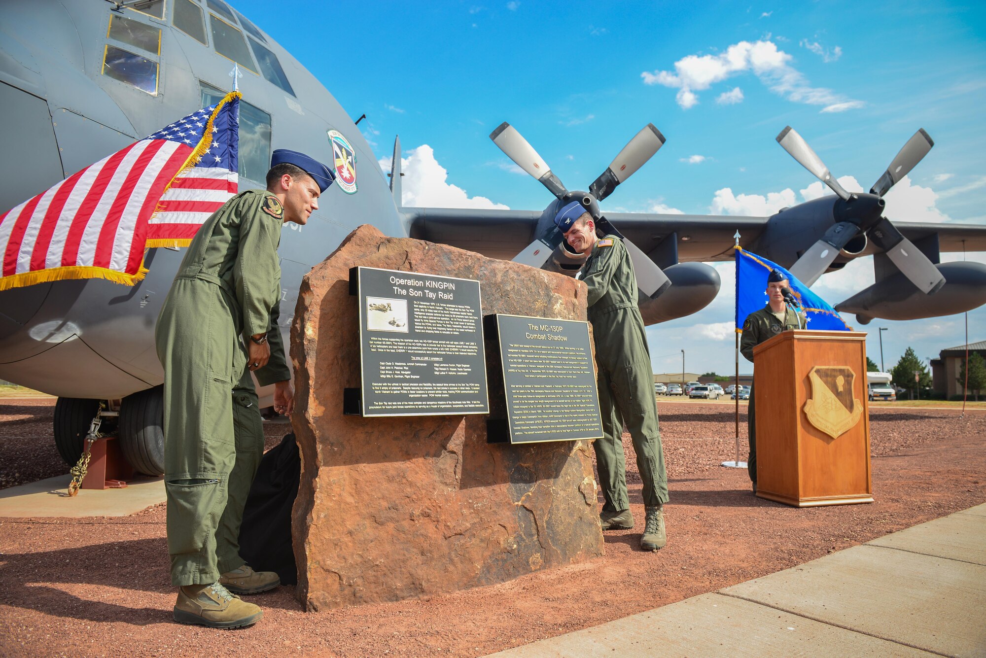 U.S. Air Force Lt. Col. Nathan Scopac, 9th Special Operations Squadron commander, and Col. Benjamin Maitre, 27th Special Operations Wing commander, reveal a plaque celebrating MC-130P Combat Shadow Lime 02 in a ceremony Sept. 3, 2015 at Cannon Air Force Base, N.M. The aircraft, long an asset of the 9th SOS, was dedicated in a ceremony remembering its role in the Son Tay Raid, an attempt to rescue U.S. Prisoners of War from a camp in Vietnam in 1970. (U.S. Air Force photo/Airman 1st Class Shelby Kay-Fantozzi)
