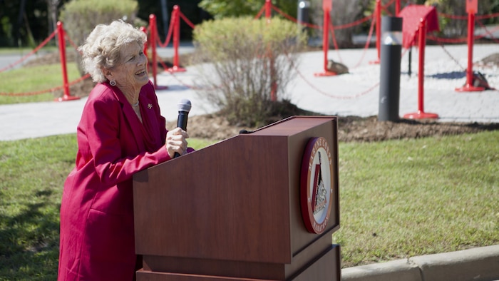 Betsy Fowler, widow of Col. James Fowler founder of the Marine Corps Marathon, speaks at the Marine Corps Marathon building dedication at Marine Corps Base Quantico, Virginia, Sept. 14, 2015. James Fowler founded the Marine Corps Marathon in 1975, while still serving at Headquarters Marine Corps, to help create a community of goodwill between the Marine Corps and the civilian populace. 