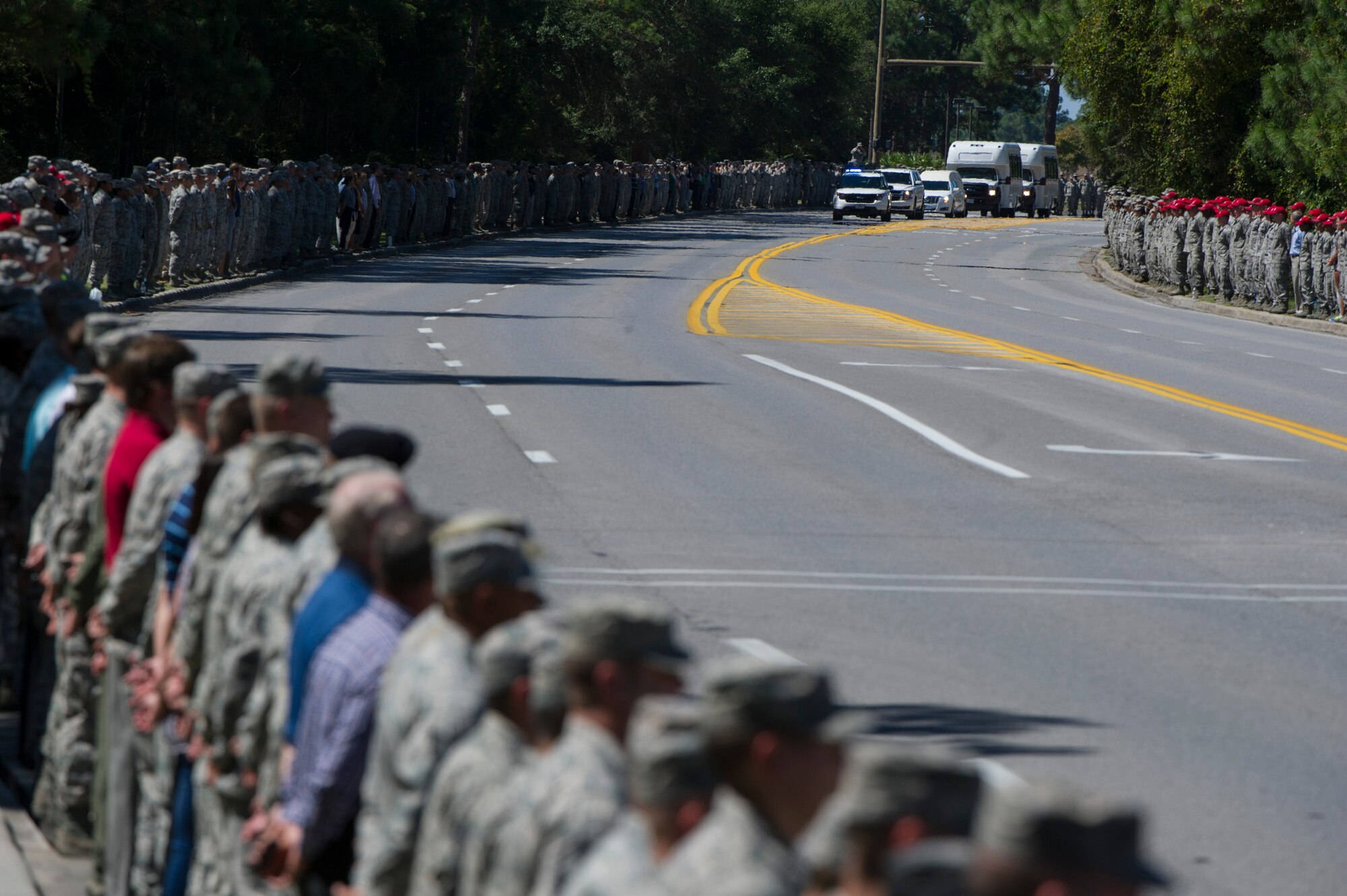 Hurlburt Field personnel line Independence Road to honor Staff Sgt. Forrest Sibley, a combat controller from the 21st Special Tactics Squadron, and his family during a procession at Hurlburt Field, Fla., Sep. 14, 2015. (U.S. Air Force Photo by Senior Airmen Hayden K. Hyatt/Released)