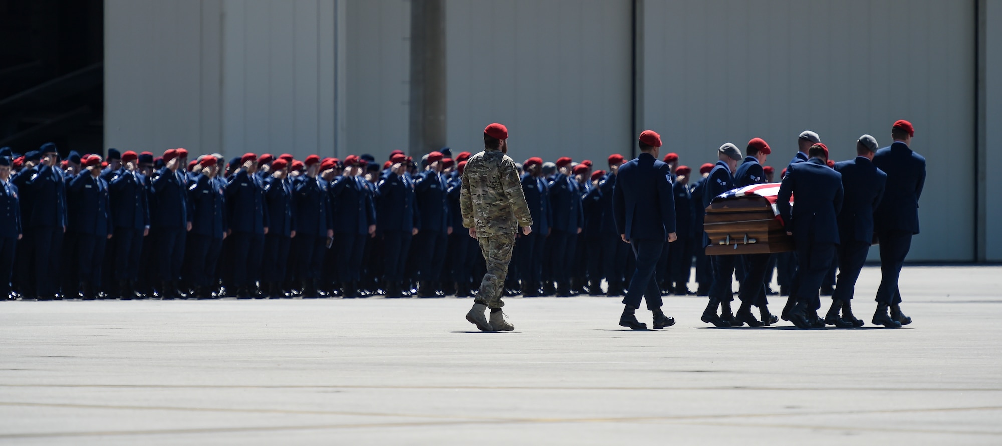 Special Tactics Airmen bear the remains of Staff Sgt. Forrest B. Sibley during a dignified transfer on Hurlburt Field, Fla., Sept. 14, 2015. The two Special Tactics Airmen, who had recently deployed to Afghanistan in support of Operation Freedom's Sentinel, were shot at a vehicle checkpoint at Camp Antonik, Afghanistan, Aug. 26, and died of wounds sustained in the attack, were honored in a private memorial.  Both Special Tactics Airmen will be buried with full military honors. (U.S. Air Force photo by Airman Kai White/Released)