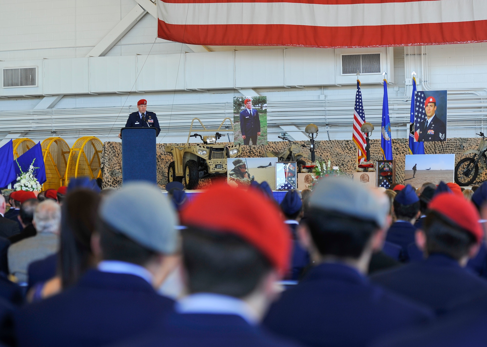 Lt. Col. Paul Brister, 23rd Special Tactics Squadron commander, speaks at the memorial service for Capt. Matthew D. Roland and Staff Sgt. Forrest B. Sibley on Hurlburt Field, Fla., Sept. 14, 2015. The two Special Tactics Airmen, who had recently deployed to Afghanistan in support of Operation Freedom's Sentinel, were shot at a vehicle checkpoint at Camp Antonik, Afghanistan, Aug. 26, and died of wounds sustained in the attack, were honored in a private memorial. Both Special Tactics Airmen will be buried with full military honors. (U.S. Air Force photo by Airman Kai White/Released)