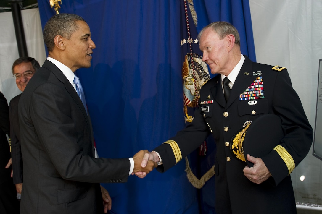President Barack Obama shakes hands with Army Gen. Martin E. Dempsey, incoming chairman of the Joint Chiefs of Staff, at the change-of-responsibility ceremony on Joint Base Myer-Henderson Hall, Va., Sept. 30, 2011. Navy Adm. Mike Mullen, outgoing chairman, retired after 43 years of service. DoD photo by U.S. Navy Petty Officer 1st Class Chad J. McNeeley