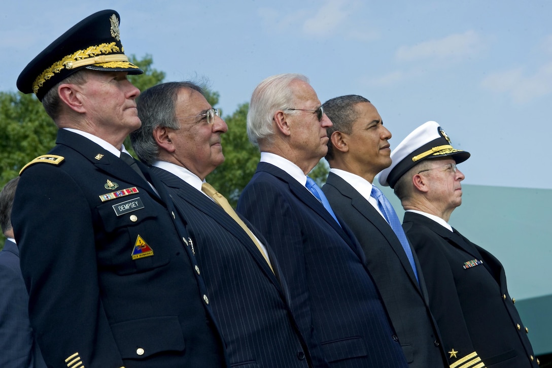 From left to right: Army Gen. Martin E. Dempsey, incoming chairman of the Joint Chiefs of Staff; Defense Secretary Leon E. Panetta; Vice President Joe Biden; President Barack Obama; and Navy Adm. Mike Mullen, outgoing chairman, observe the honor guard during the change-of-responsibility ceremony on Joint Base Myer-Henderson Hall, Va., Sept. 30, 2011. DoD photo by U.S. Navy Petty Officer 1st Class Chad J. McNeeley