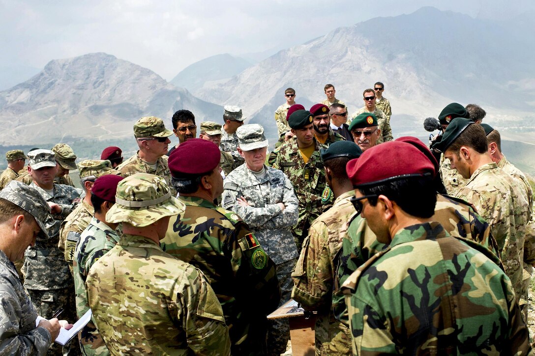 U.S. Army Gen. Martin E. Dempsey, chairman of the Joint Chiefs of Staff, receives a mountaintop briefing from American and Afghan Special Forces on Camp Moorehead, Afghanistan, April 23, 2012.  DoD photo by D. Myles Cullen