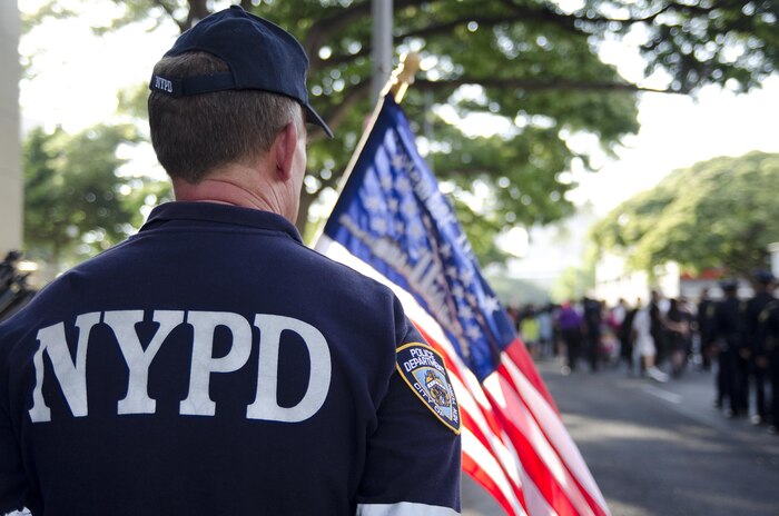 Honolulu resident Karl Steininger waits as dignitaries head into the street to lead the procession during the 10th annual Mayor’s Remembrance Walk, Sept. 6, 2015. Steininger, who currently works for the Honolulu Police Department, is retired from the New York Police Department, and was one of the first responders during the Sept. 11, 2001, attacks. Dignitaries, various government agencies, first responders, organizations and other members of the community honored lives lost in the Sept. 11, 2001, attacks with a walk through Honolulu. Walkers paused for brief ceremonies at Honolulu Police Department headquarters, Honolulu Fire Department headquarters and Honolulu Hale with remarks by various speakers. The Royal Hawaiian Band and Halau Hula O Maiki performed during the closing ceremony at Honolulu Hale. (U.S. Marine Corps photo by Kristen Wong/Released)