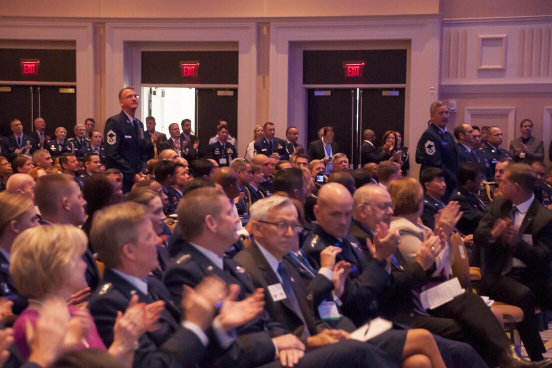 Crew members from the 920th Rescue Wing who participated in the June 2005 rescue of Marcus Luttrell, a U.S. Navy SEAL, stand to be recognized during the Air Force Association Air and Space Conference and Technology Exposition, Washington D.C., Sept. 14, 2015. The well-known rescue was dramatized in the movie “The Lone Survivor.” (U.S. Air Force photo/Staff Sgt. Kat Justen)
 