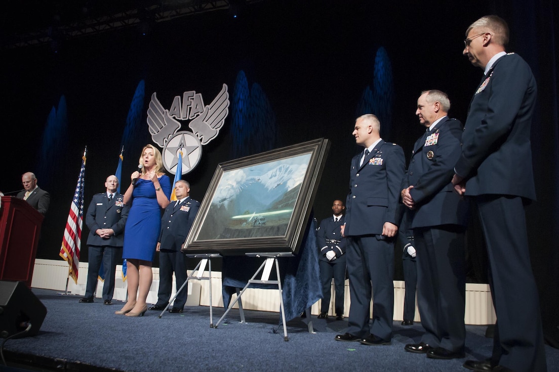 Air Force Secretary Deborah Lee James gives remarks during the unveiling ceremony of the painting “That Others May Live” during the Air Force Association Air and Space Conference and Technology Exposition, Washington D.C., Sept. 14, 2015. “That Others May Live” documents the rescue of Marcus Luttrell, a U.S. Navy SEAL, in June 2005 by Reservists from the 920th Rescue Wing, Patrick Air Force Base, Fla. The well-known rescue was dramatized in the movie “The Lone Survivor.” (U.S. Air Force photo/Staff Sgt. Kat Justen)