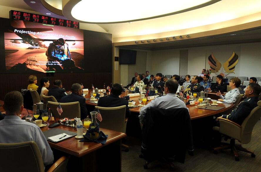 Gen. Lori J. Robinson, Pacific Air Forces commander, briefs Air Chiefs from Australia, Cambodia, Nepal, Japan, Mongolia, Bangladesh and the Philippines during the Pacific Air Chiefs Symposium at Joint Base Pearl Harbor-Hickam, Hawaii, Sept. 12, 2015. Robinson and the Air Chiefs spent two days discussing air operations in the Pacific region, and attending the 68th Annual Air Force Birthday Ball before heading to Washington, D.C., for the Air Force Association Annual Air and Space Conference and Technology Exhibition. The symposium helped further the Air Force's partnership with the countries by showcasing PACAF's use of airpower in humanitarian assistance and disaster relief operations and providing a forum for the Air Chiefs to discuss training standardization and improve interoperability. (U.S. Air Force photo by Staff Sgt. Alexander Martinez/Released)