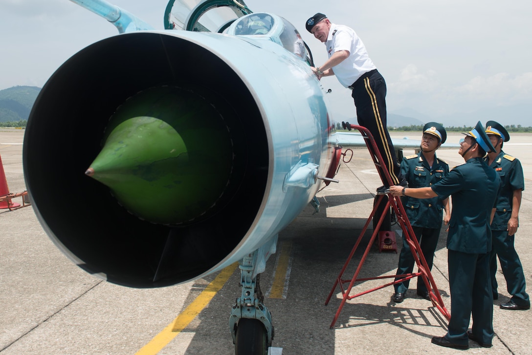U.S. Army Gen. Martin E. Dempsey, chairman of the Joint Chiefs of Staff, looks at one of the trainer jets members of the Vietnam Air Division 372 use in Da Nang, Vietnam, Aug. 15, 2014. DoD photo by D. Myles Cullen