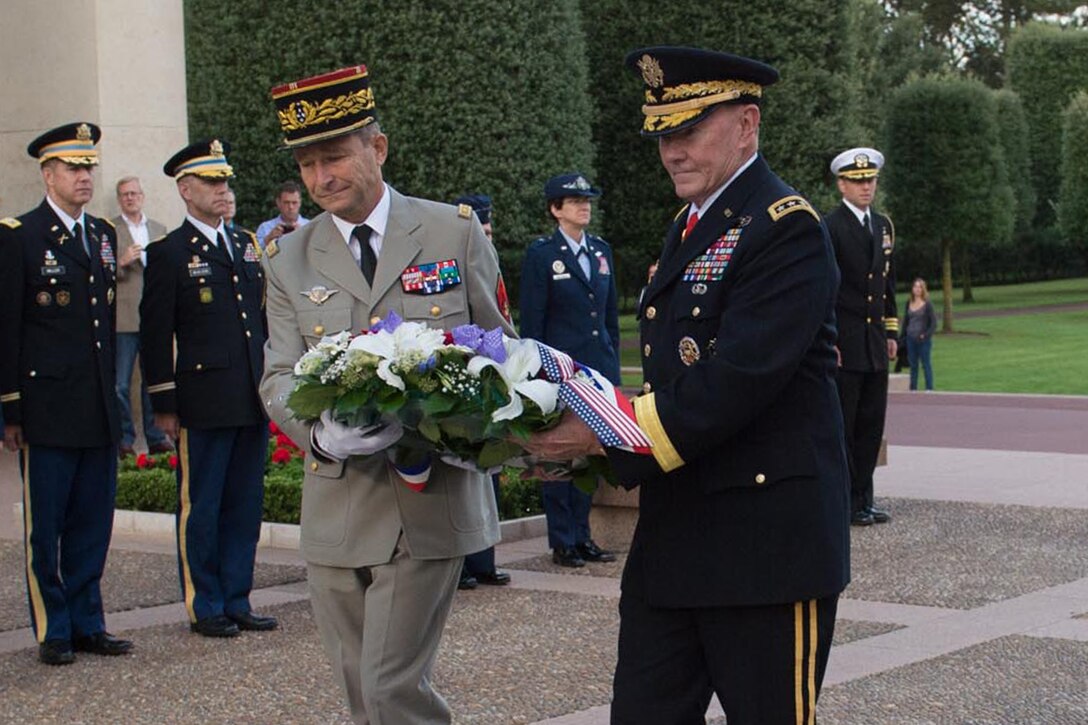 U.S. Army Gen. Martin E. Dempsey, chairman of the Joint Chiefs of Staff, and his French counterpart, Gen. Pierre de Villiers, lay a wreath at the Normandy American Cemetery and Memorial in Normandy, France, Sept. 19, 2014. DoD photo by D. Myles Cullen